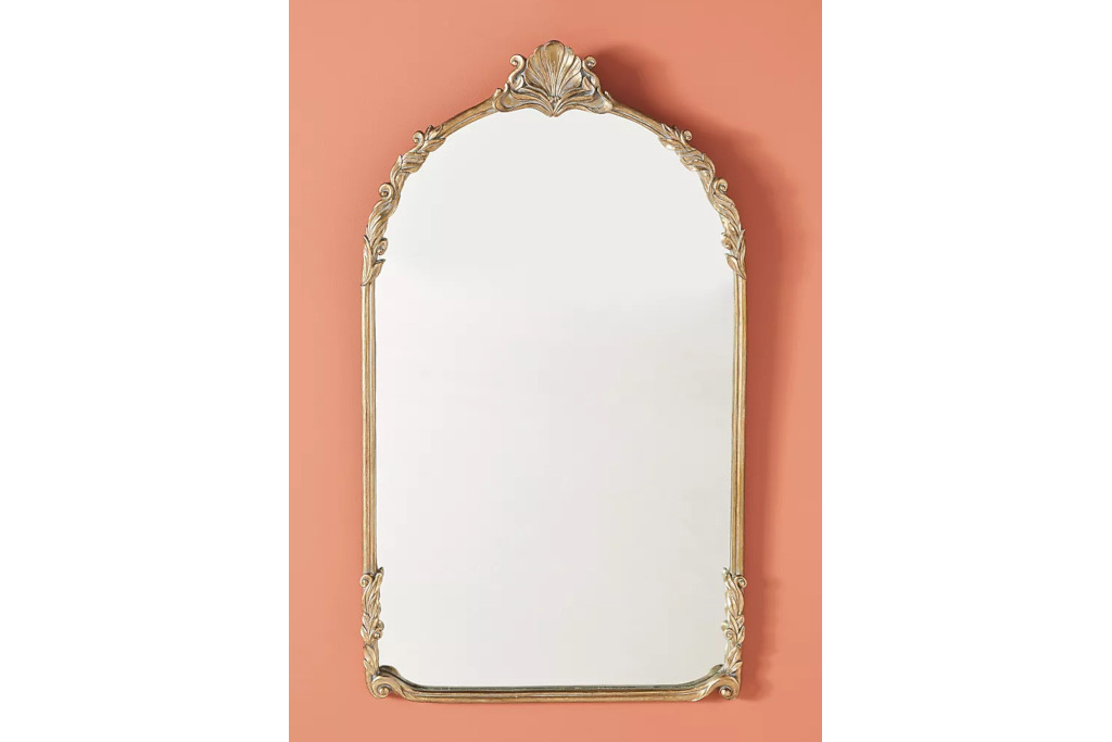 Gold mirror on pink background