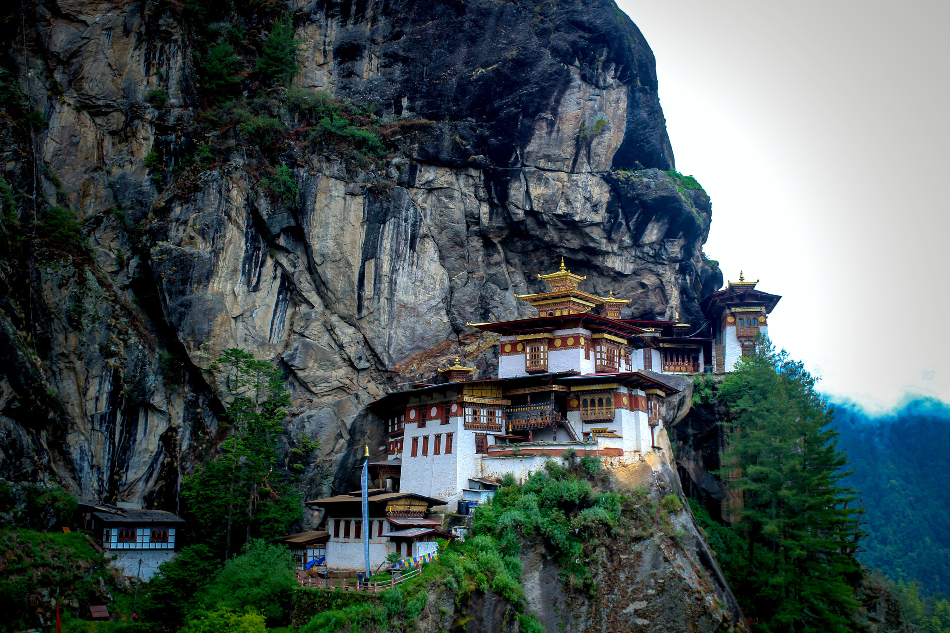 a building on a cliff face in bhutan