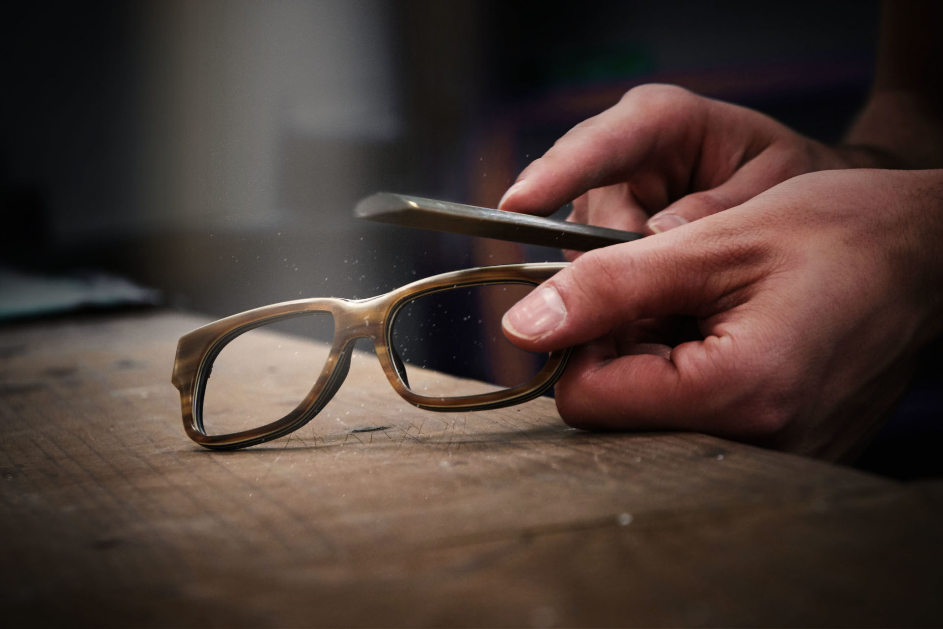 Close up of glasses frames being filed