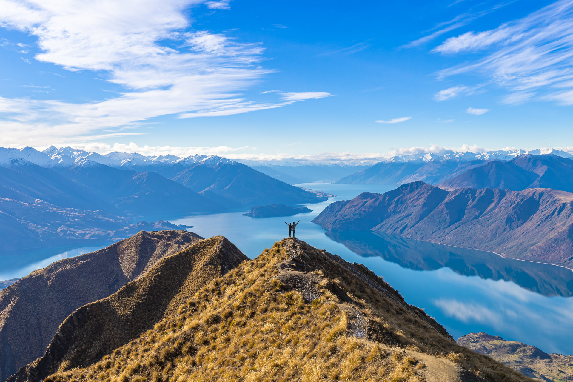 couple celebrating success at Roy's Peak Lake Wanaka New Zealand