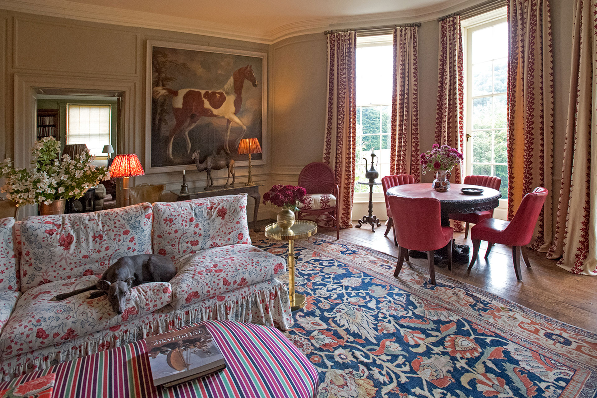 Lulu Lytle's Soane Britian sitting room interior with a whippet on the floral sofa