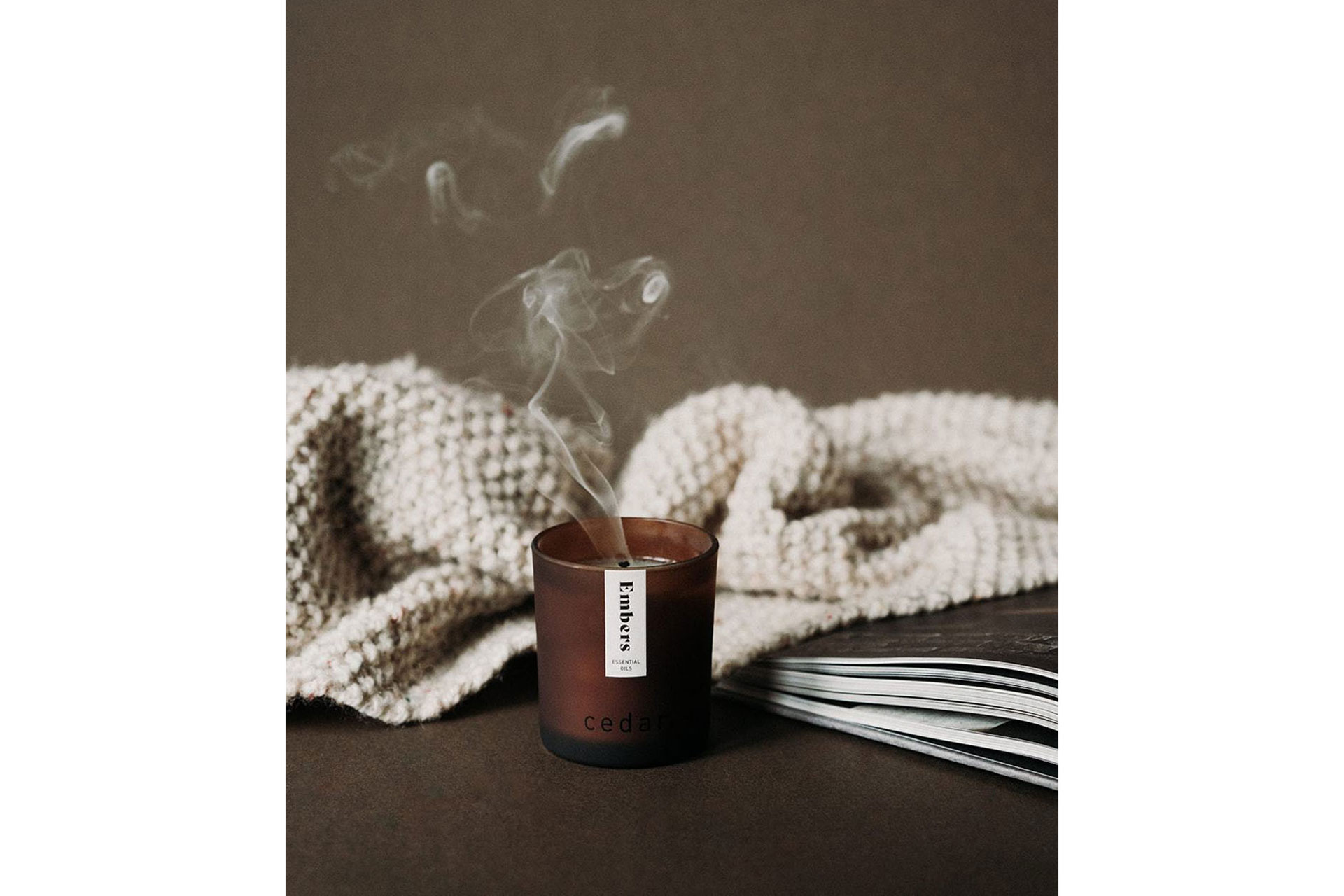 a sustainable candle is blown out with smoke going into the air