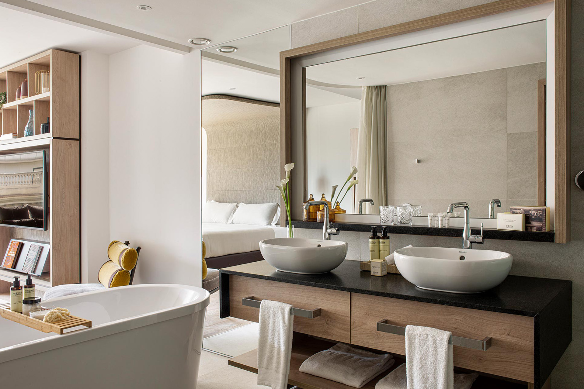 a bathroom leading to an open plan bedroom