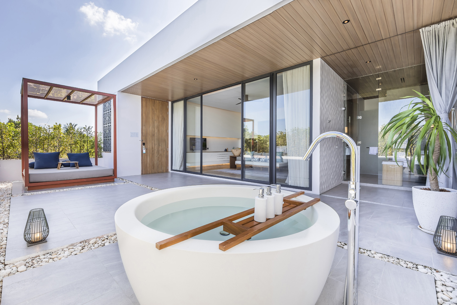 an outdoor bathtub outside a villa