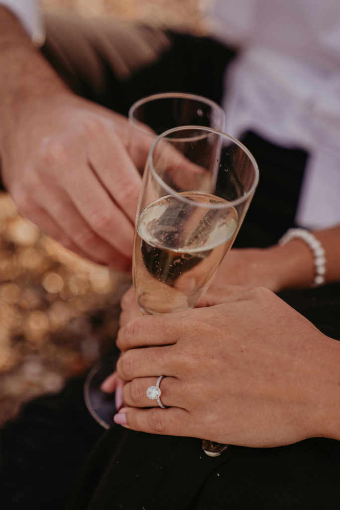 A couple holding champagne