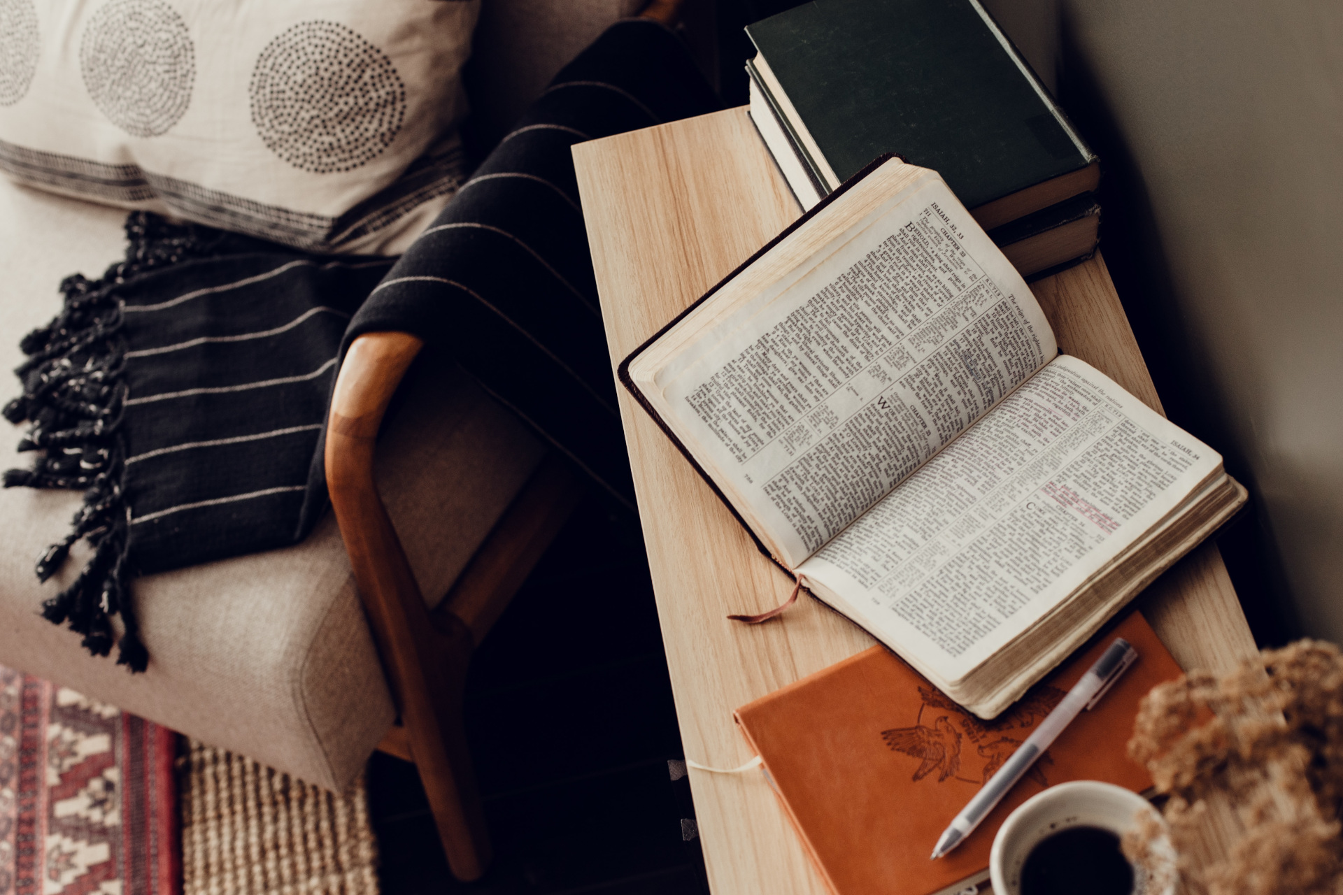 Book on desk with chair and blankets