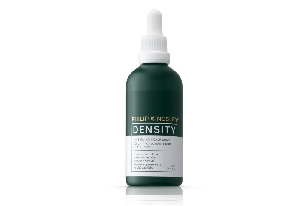 Green bottle of hair serum
