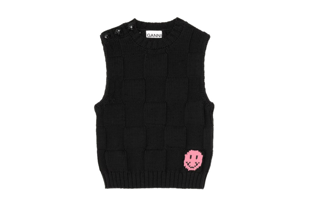 Black vest with a pink smiley face