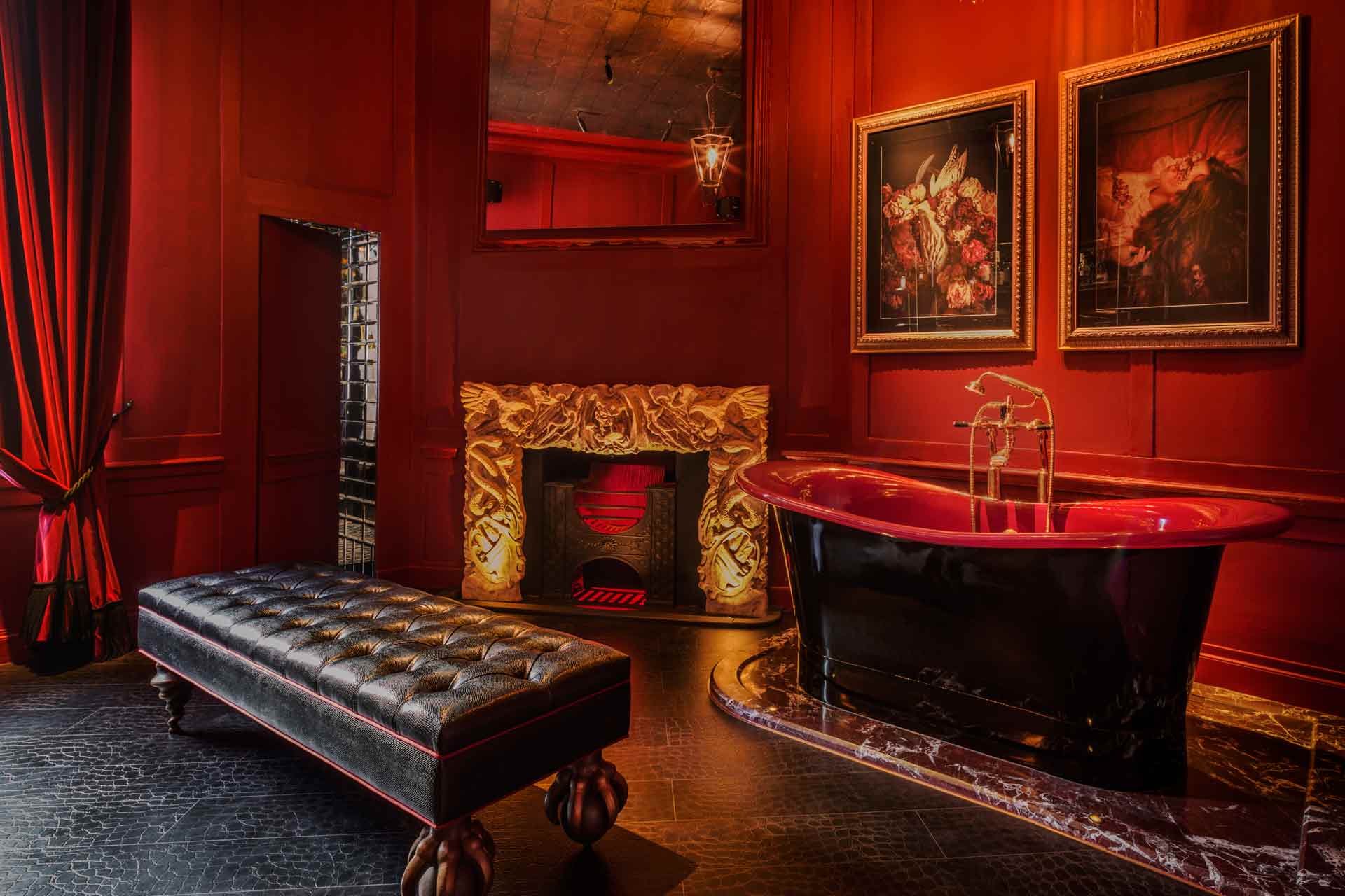 red roll top bath in the bathroom at Chateau Denmark, Soho