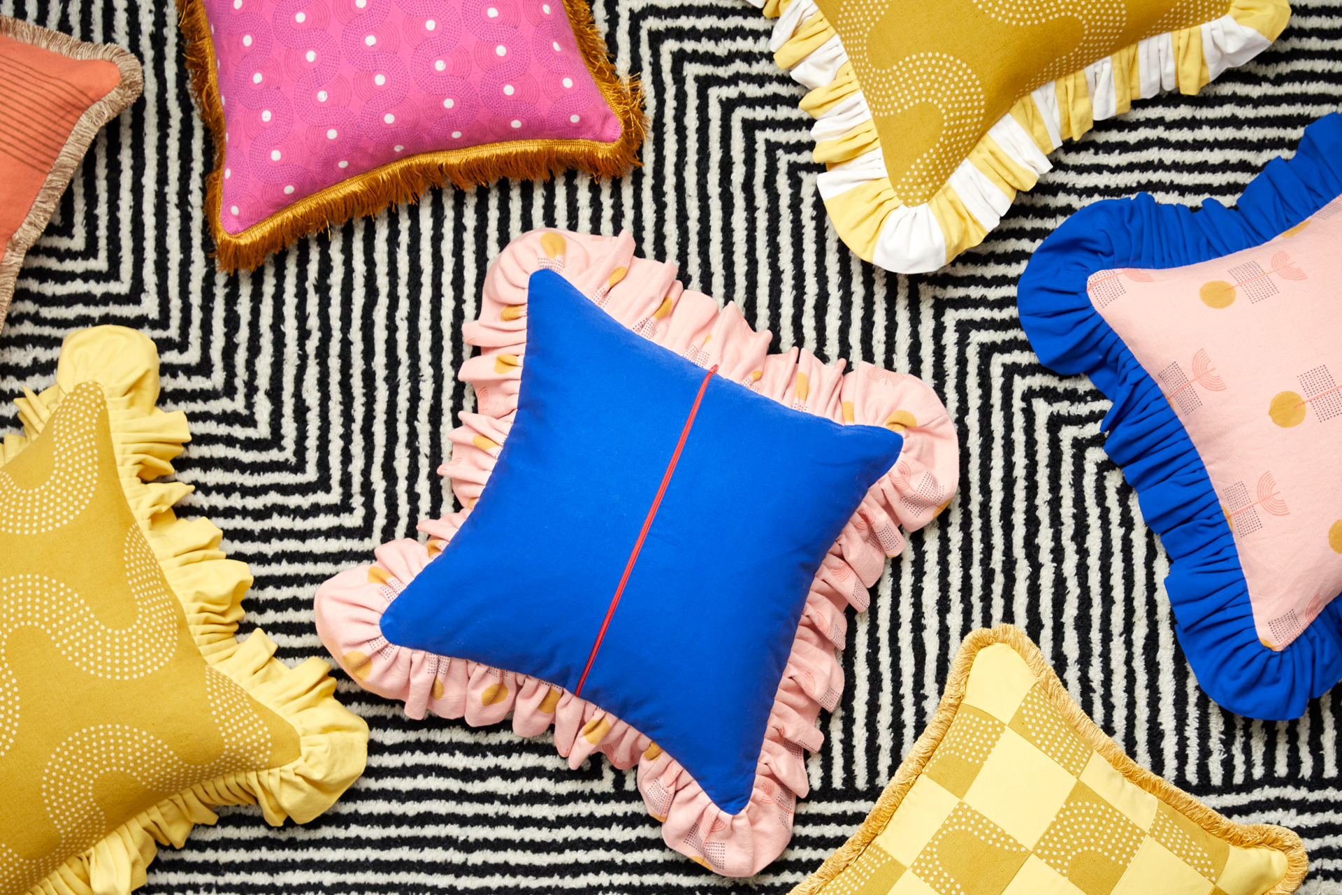Brightly coloured cushions by In Casa by Paboy