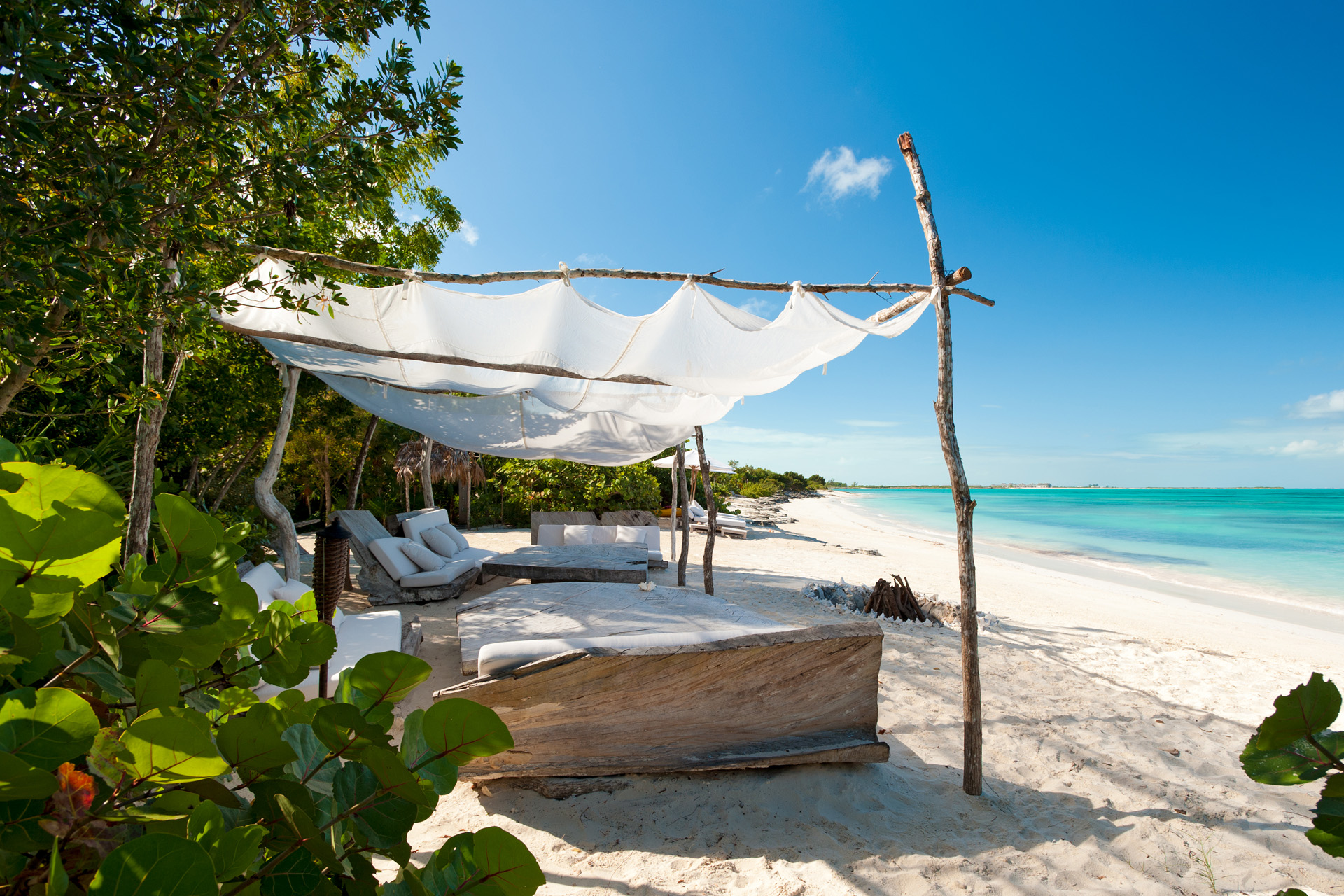 beach beds under a parasol facing the seal