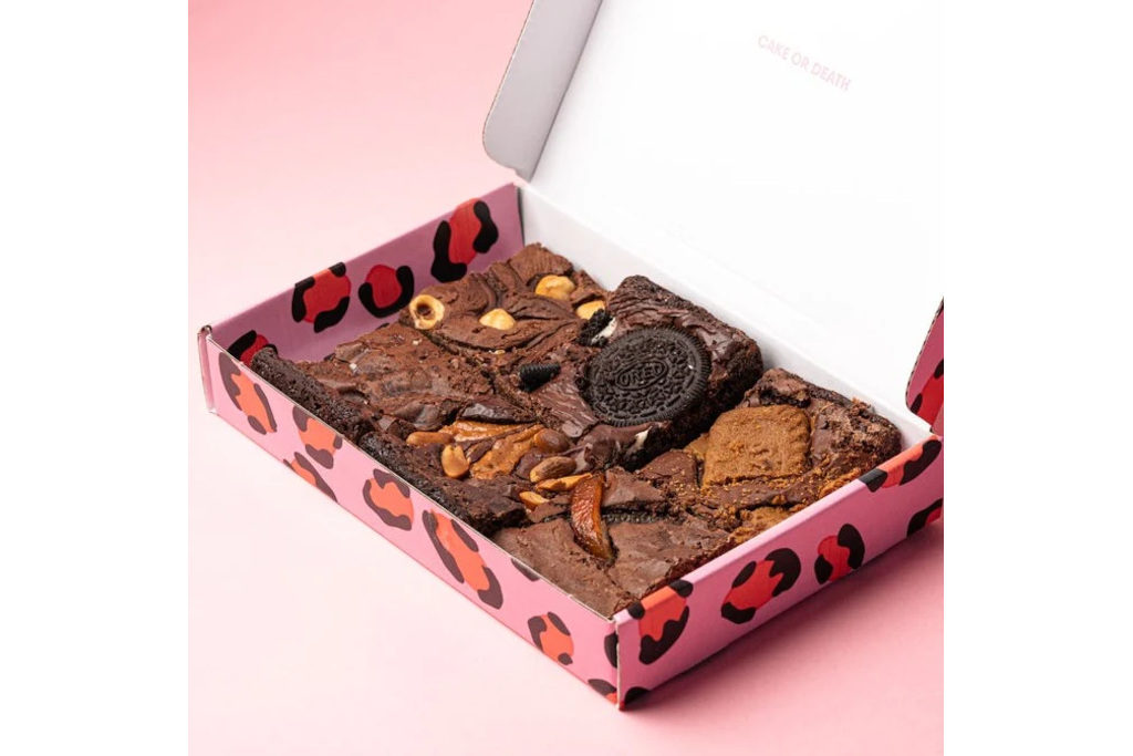 Brownies in pink box on pink background