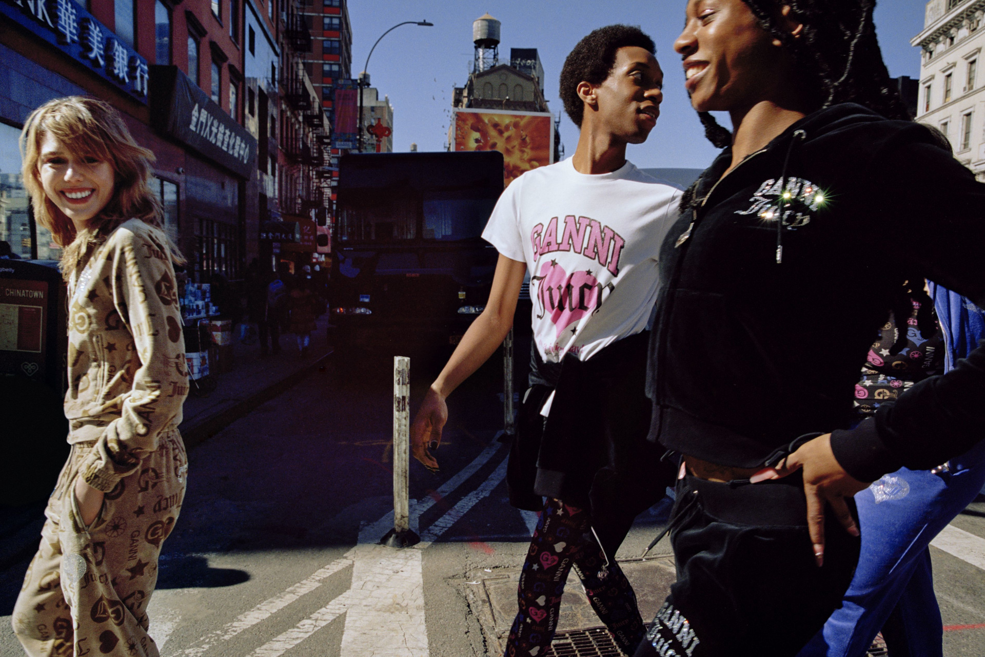 Models walking through New York wearing GANNI x Juicy Couture clothing