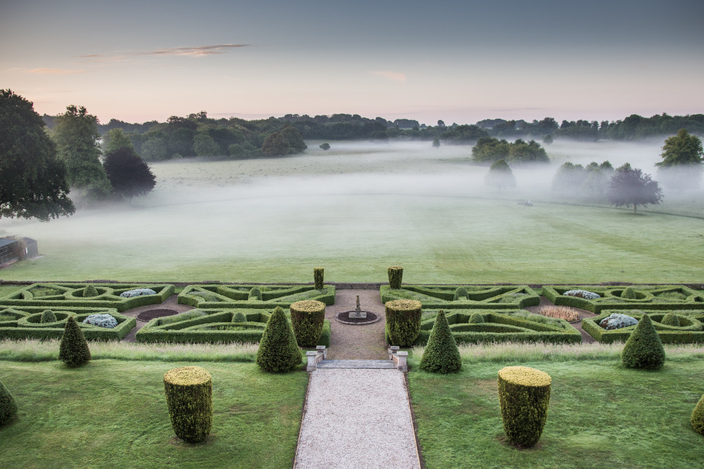 Goodnestone Park pretty manicured gardens with mist at dawn
