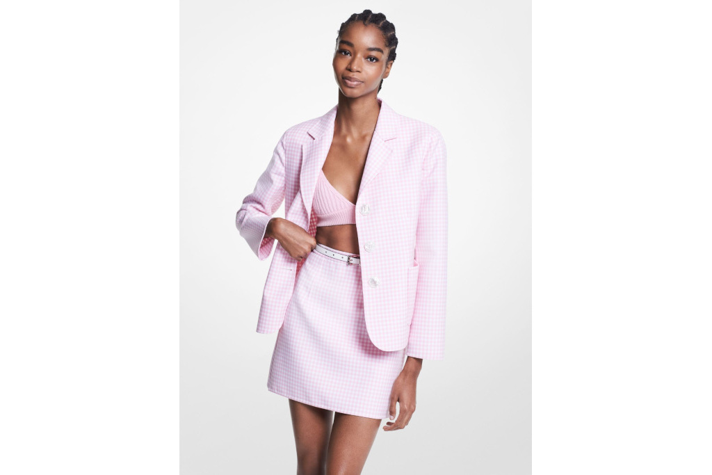 Model in pink gingham skirt suit