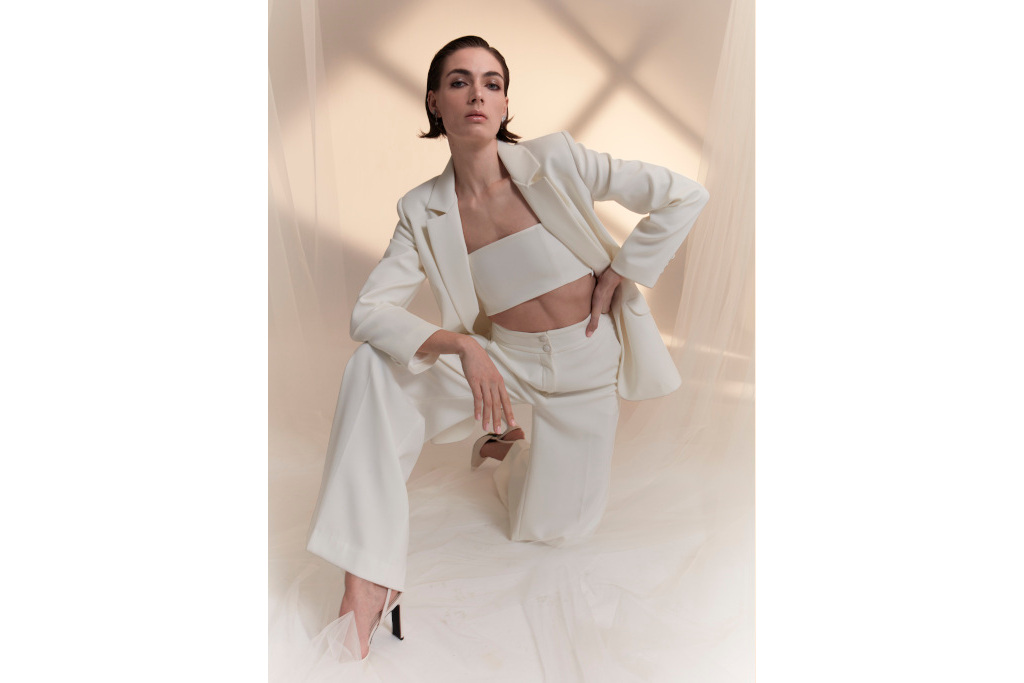 Bride in a white suit and crop top