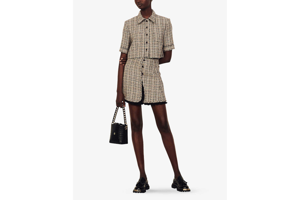 Model in brown tweed short sleeve jacket and miniskirt