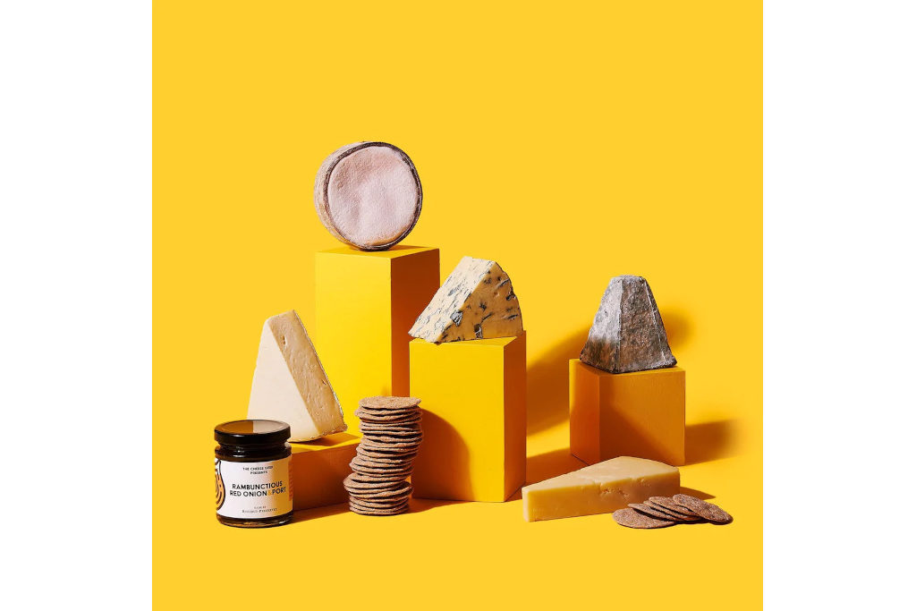 Cheese and biscuits on yellow background