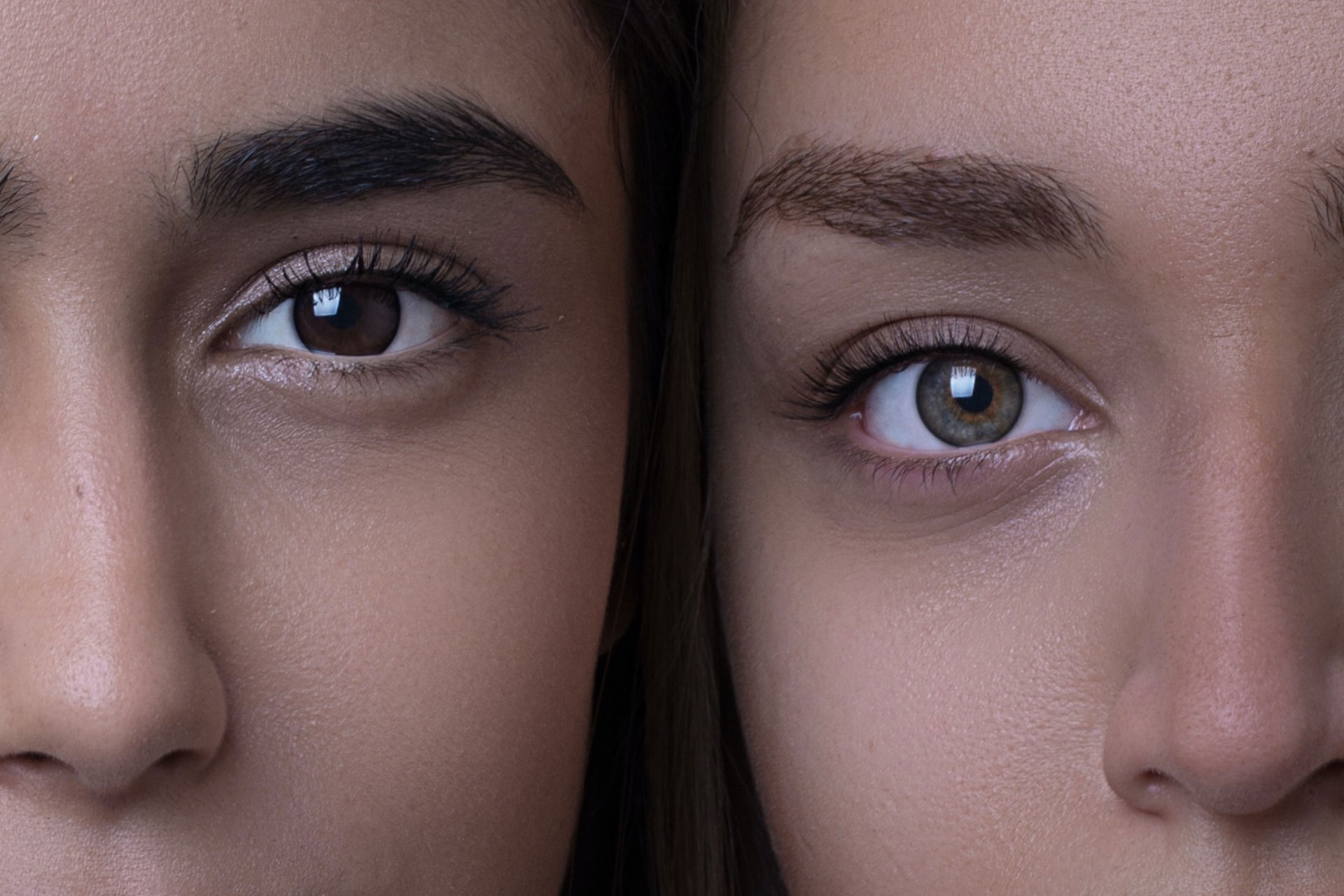 Two women's faces close together