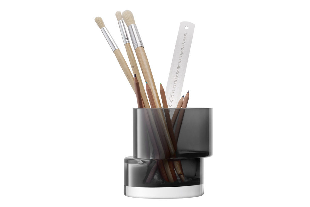Grey tiered glass vase with brushes and pencils inside