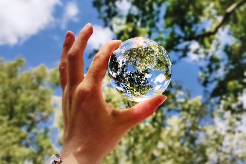 unsplash hand holding bubble nature