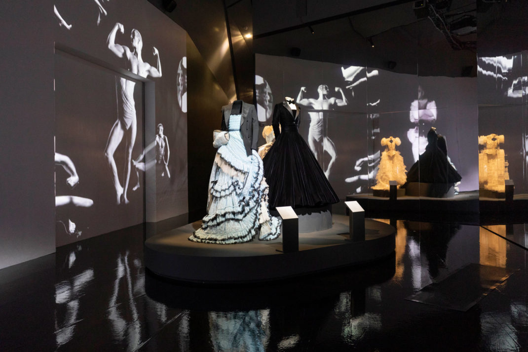 a Christian Siriano tuxedo gown worn by Billy Porter, an Alessandro Michele for Gucci custom gown and tailored jacket worn by Harry Styles, and a wedding dress by Ella Lynch worn by Bimini Bon Boulash – alongside a specially commissioned, monumental film by Quentin Jones with Cadence Films.