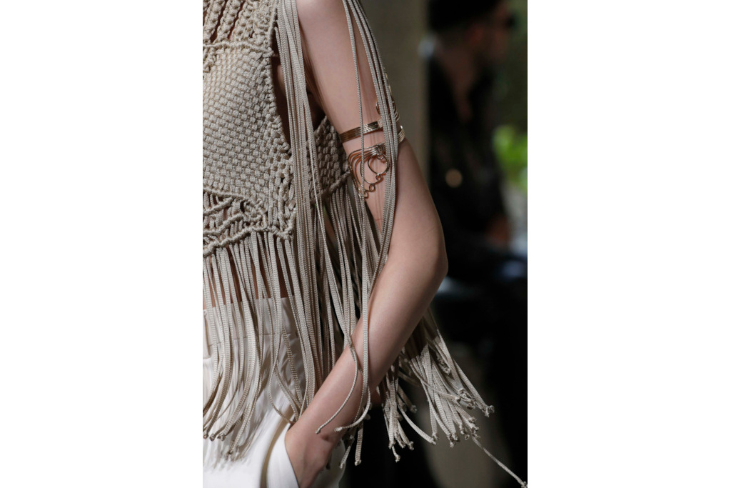 Close up of model wearing fringe top