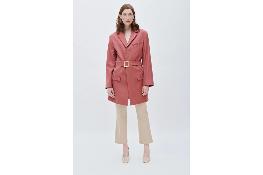 Model in pink belted coat