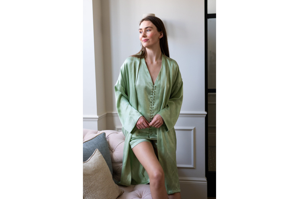 Model in sage green pyjamas and robe