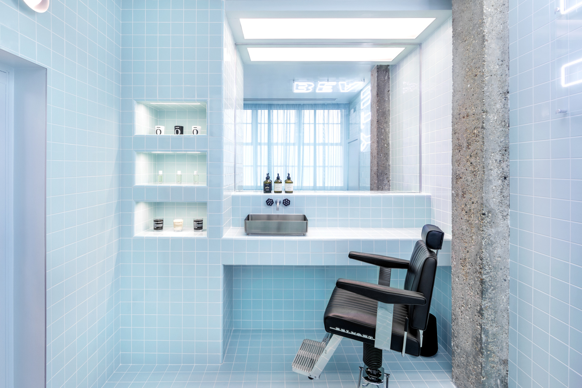 Blue tiled beauty salon with chair and vanity