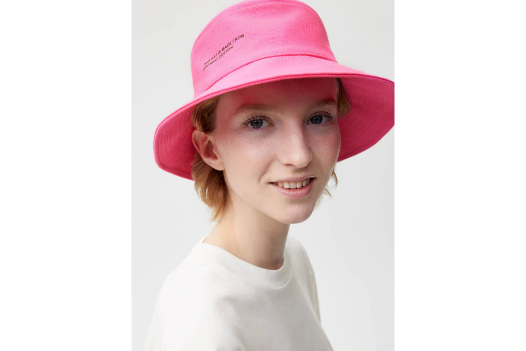 Model in pink bucket hat