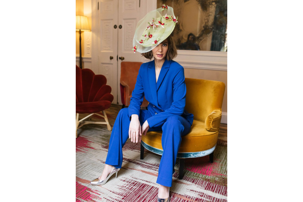 Woman in blue suit and yellow hat
