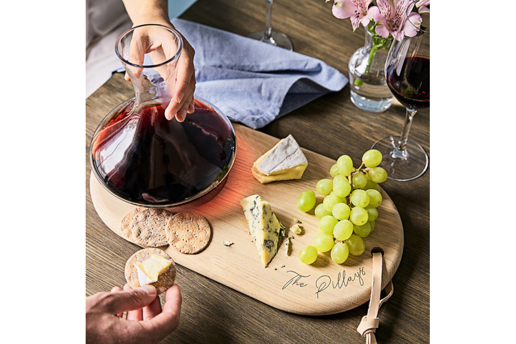 Cheese board with grapes and wine