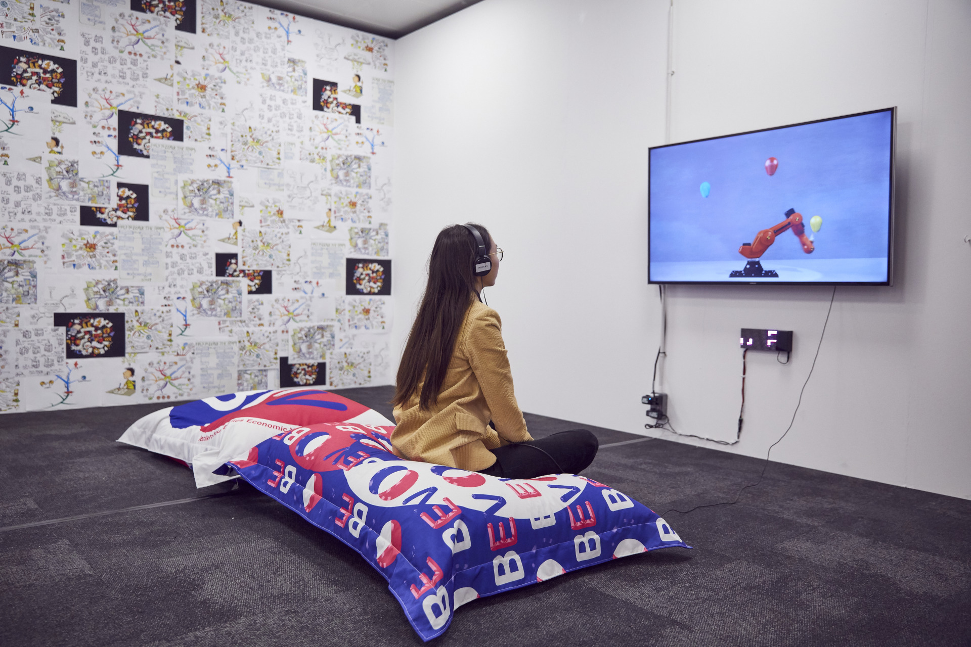 Woman sat watching a screen