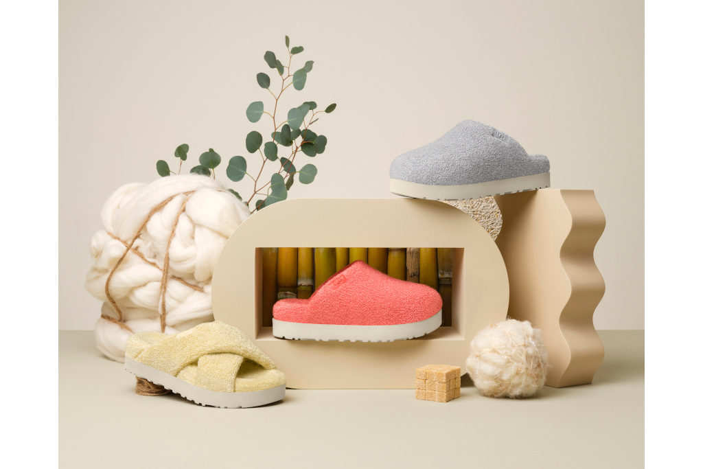 Boots and slides set up around curvy foot stool and sculpture
