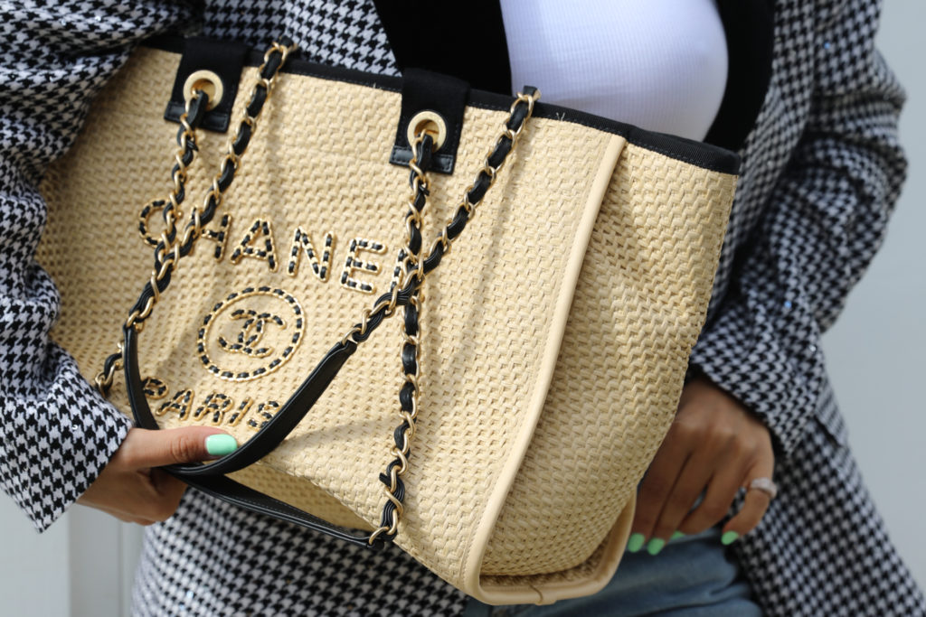 Woman carrying Chanel handbag