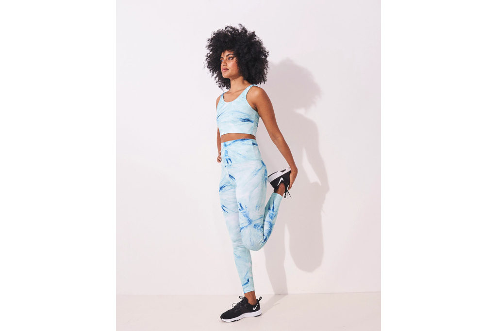 Model in blue tie dye activewear