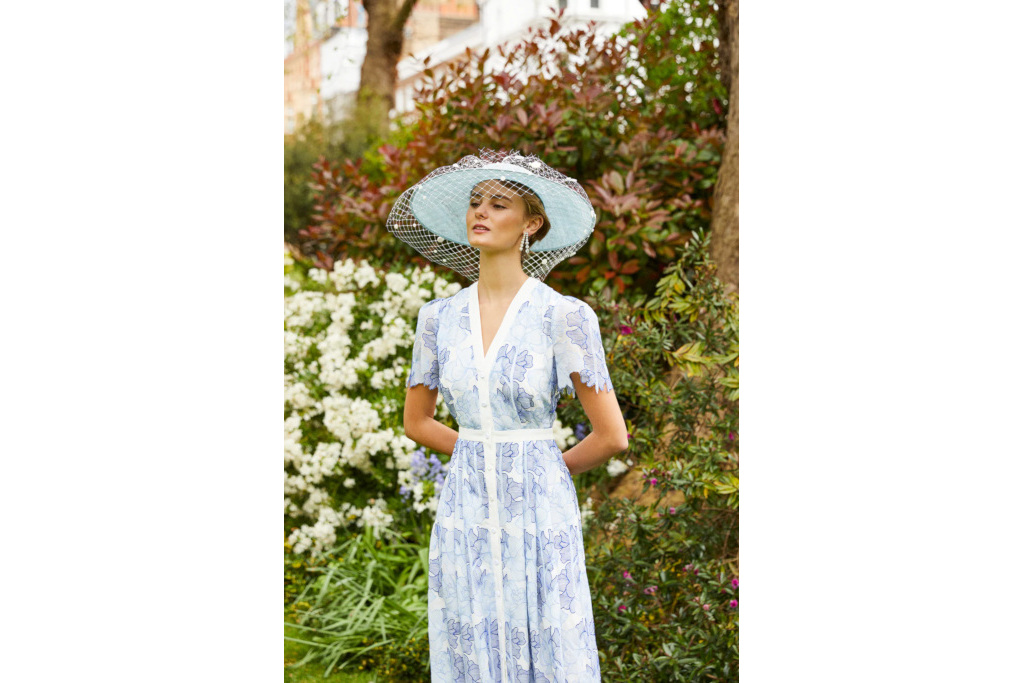 Woman in blue hat and dress