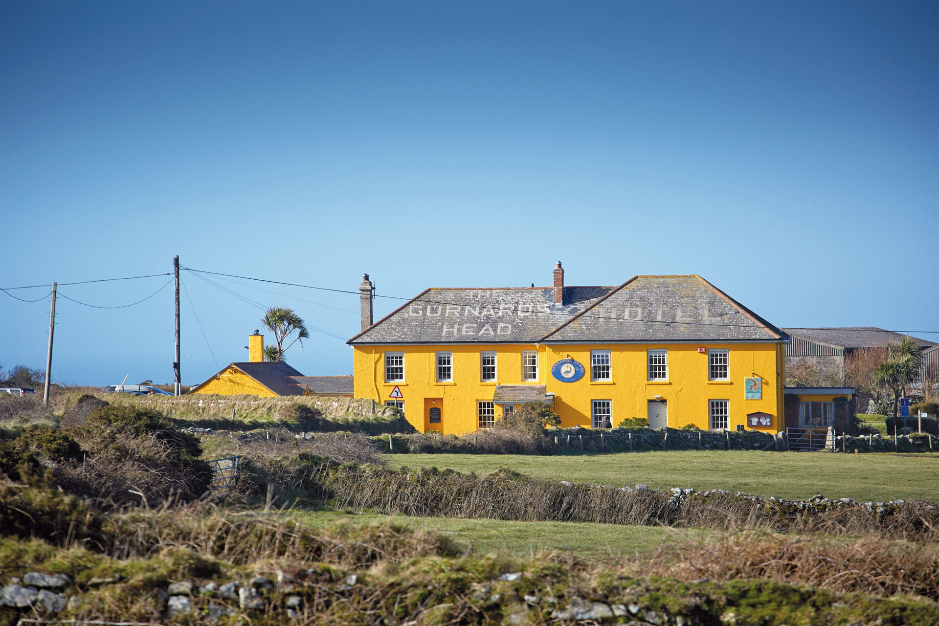 Yellow hotel in field