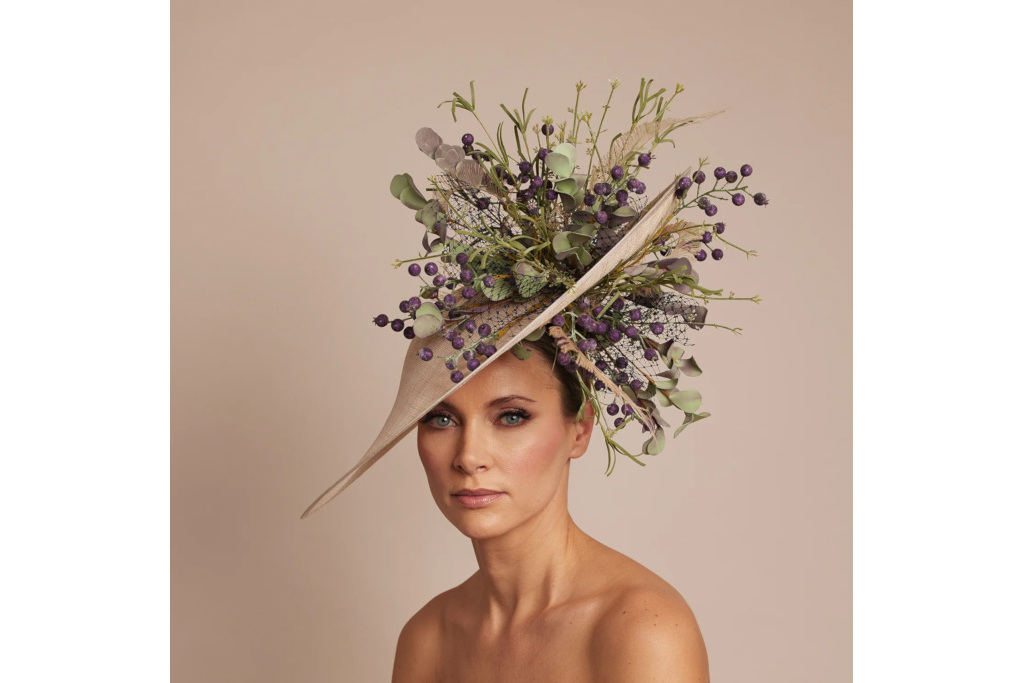 Woman in floral hat made by British milliner Vivien Sheriff