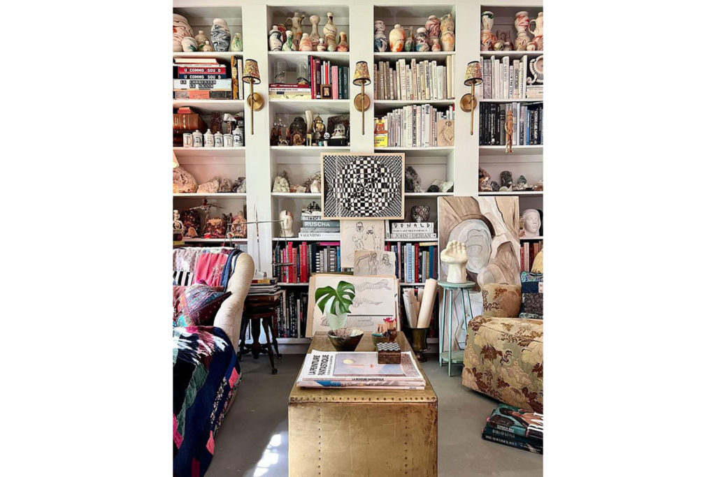 Courtney Madden's home library stacked with books in a maximalist fashion