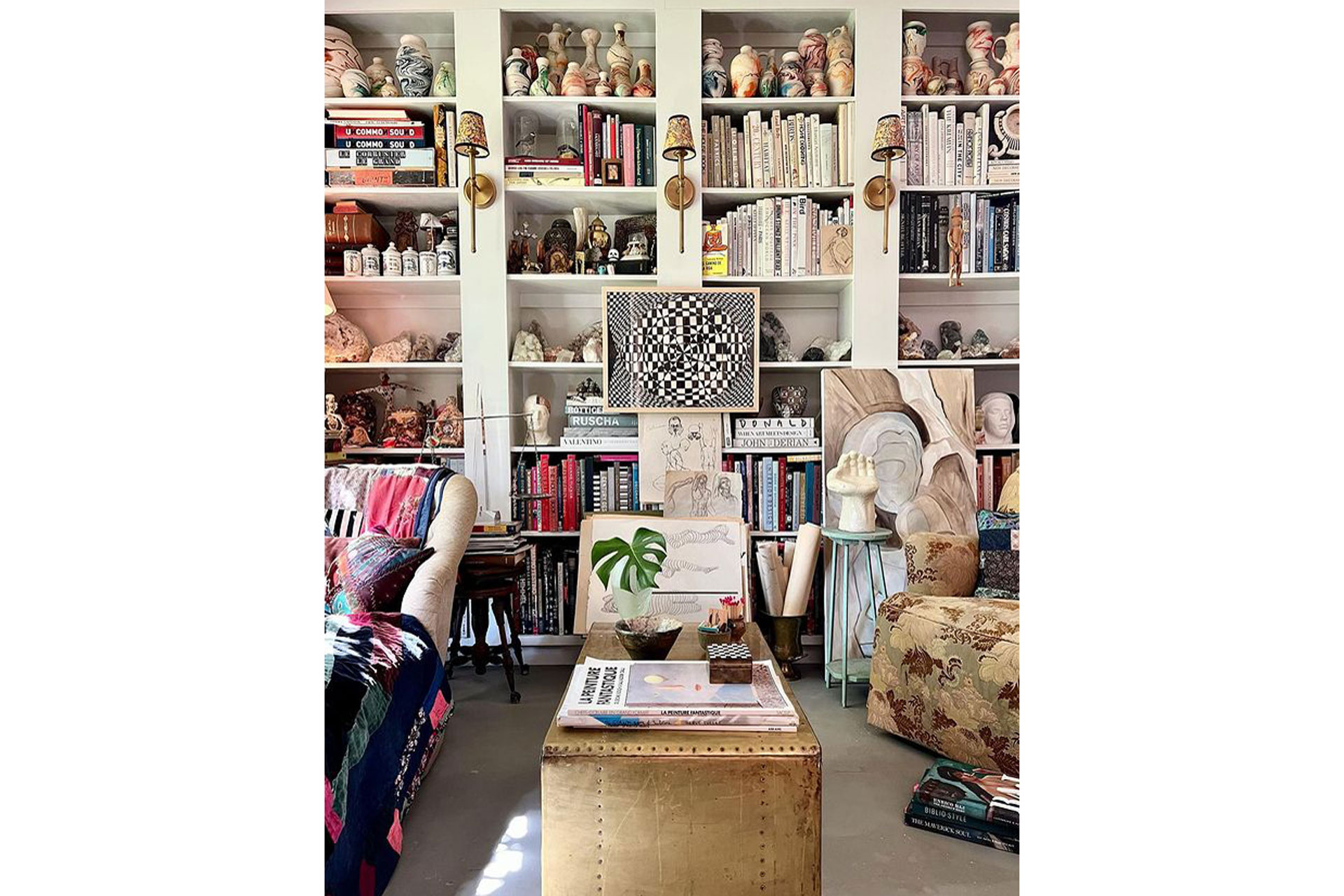 Courtney Madden's home library stacked with books in a maximalist fashion