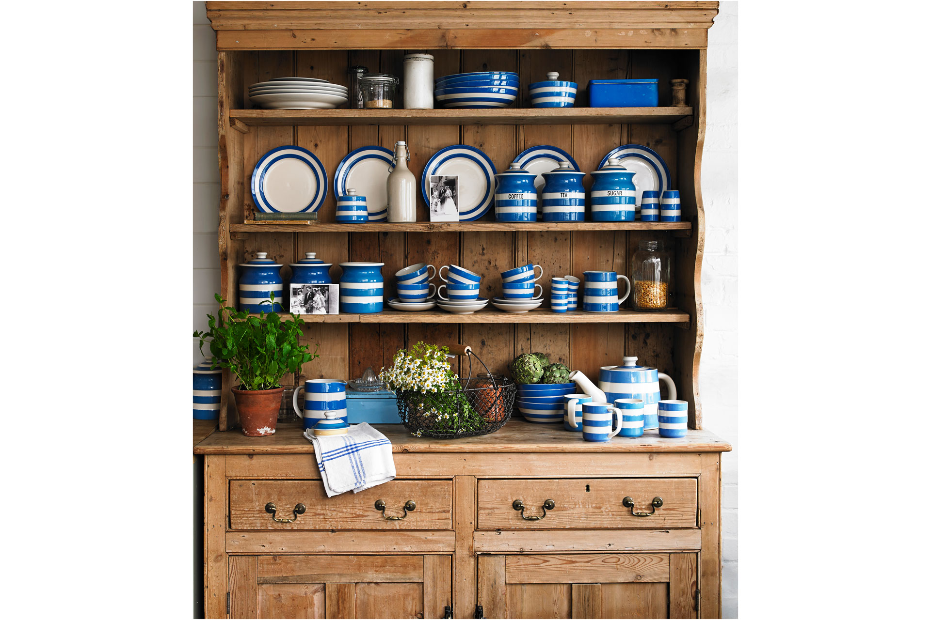 Cornishware dresser of stripey crockery, stripey plates, stripey bowls