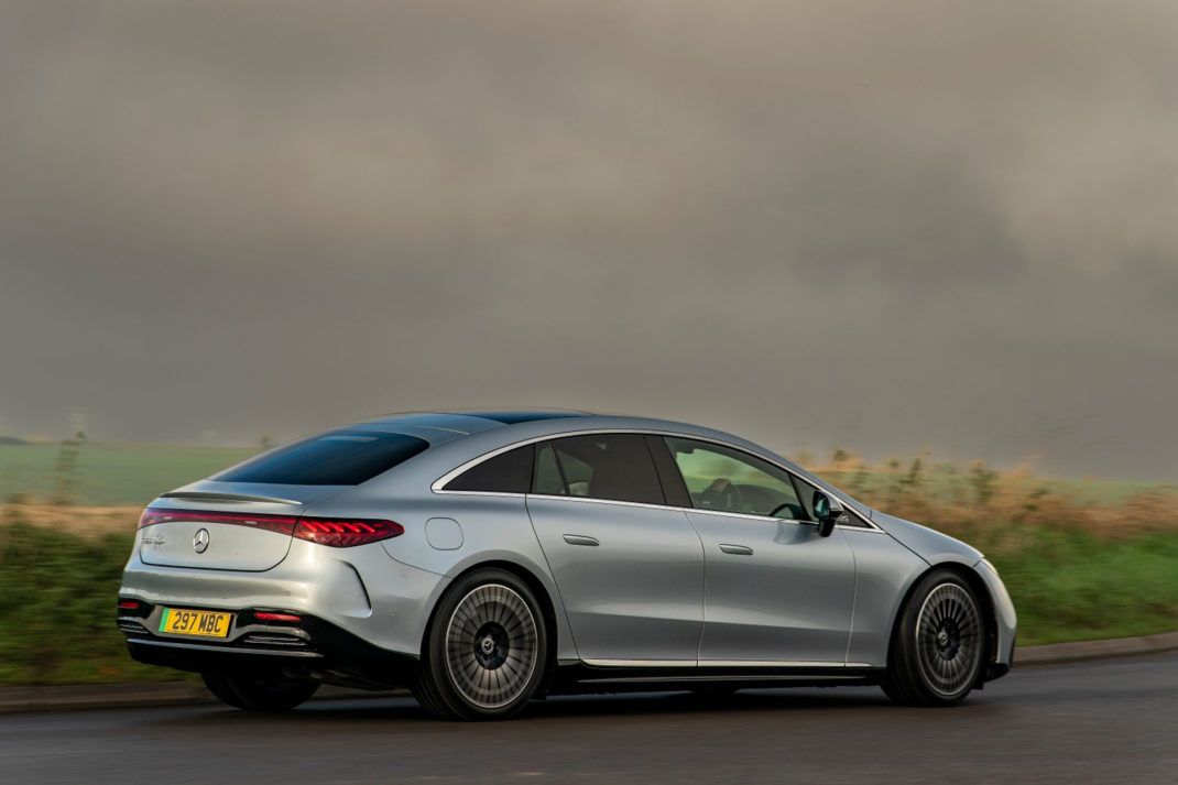 exterior view of Mercedes EQS in a verdant landscape 