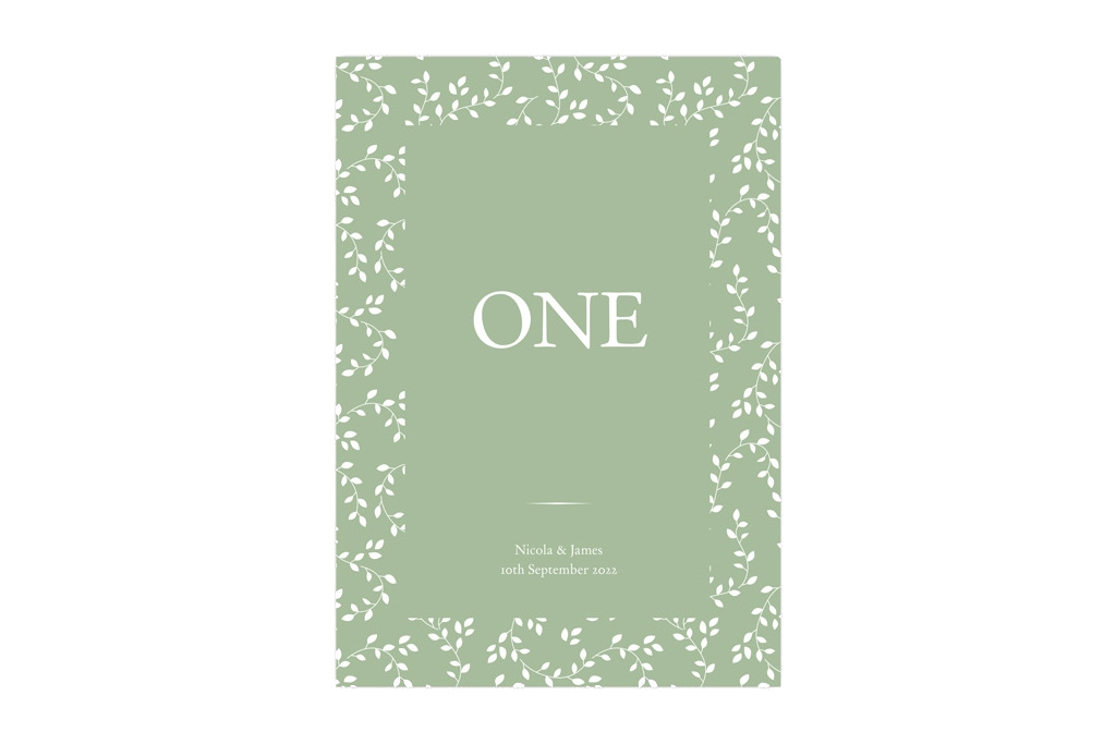 Green table number card with white leaves and flowers
