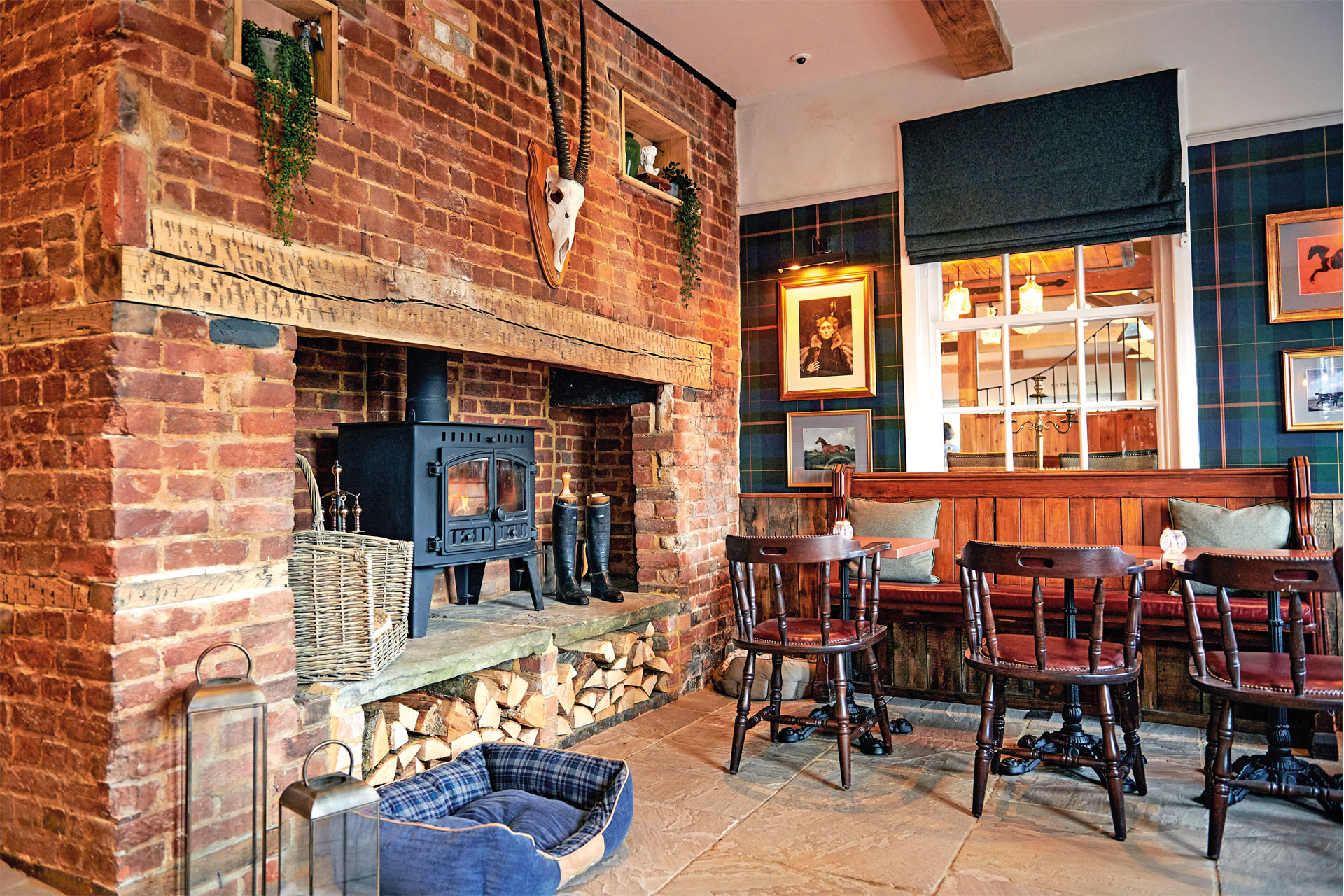 A bar with three chairs in the Hare & Hounds