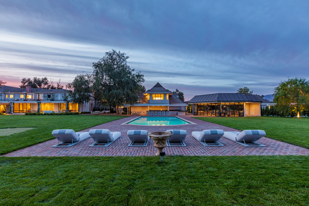 exterior of pool in front of california villa