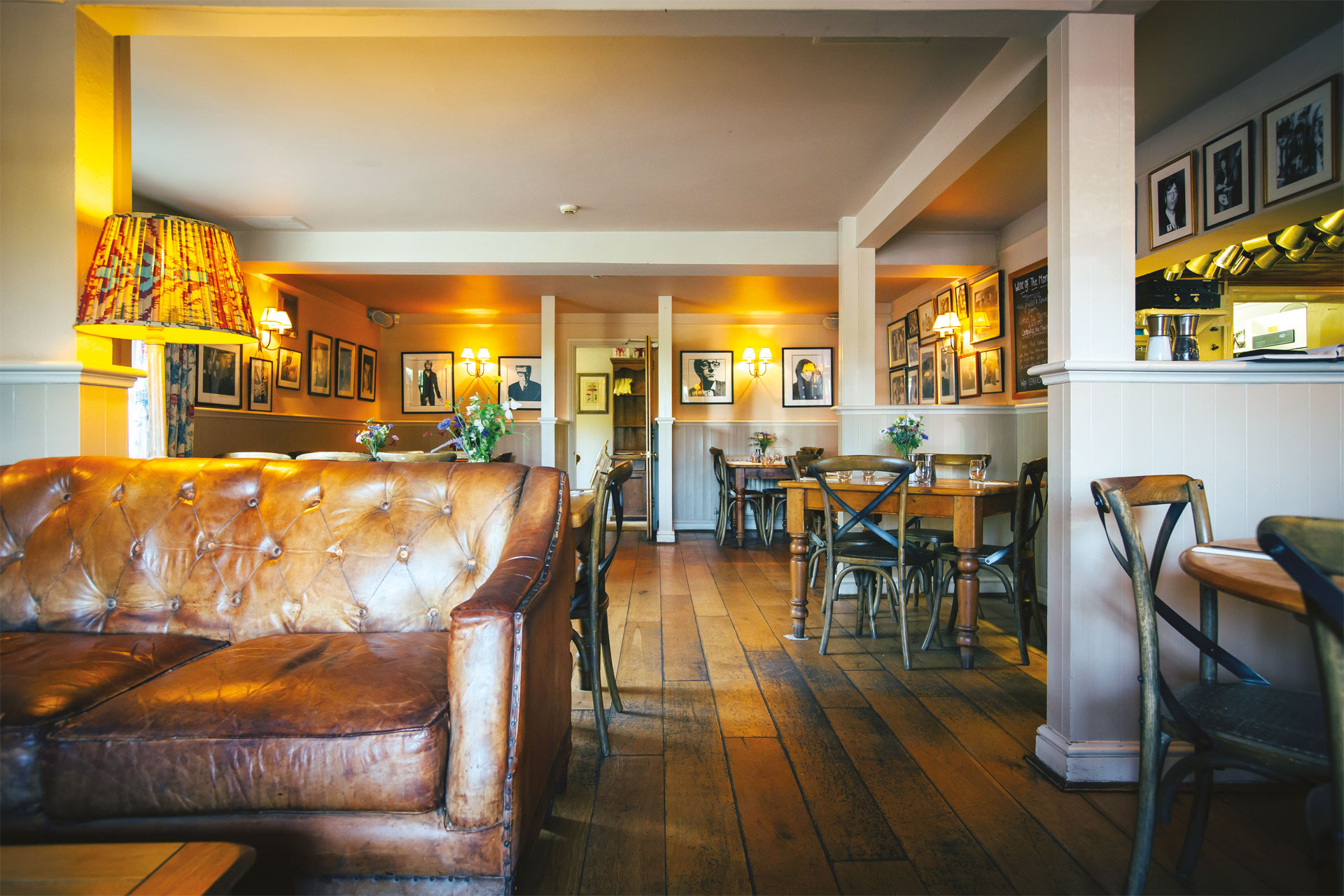 A bar with a brown, leather sofa
