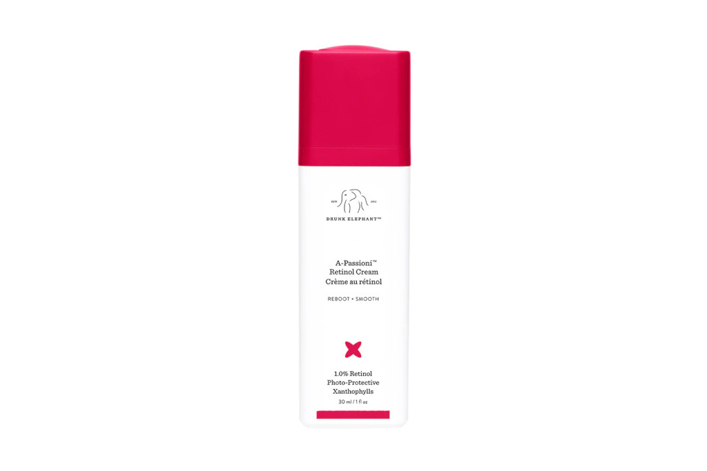 White retinol cream bottle with pink cap