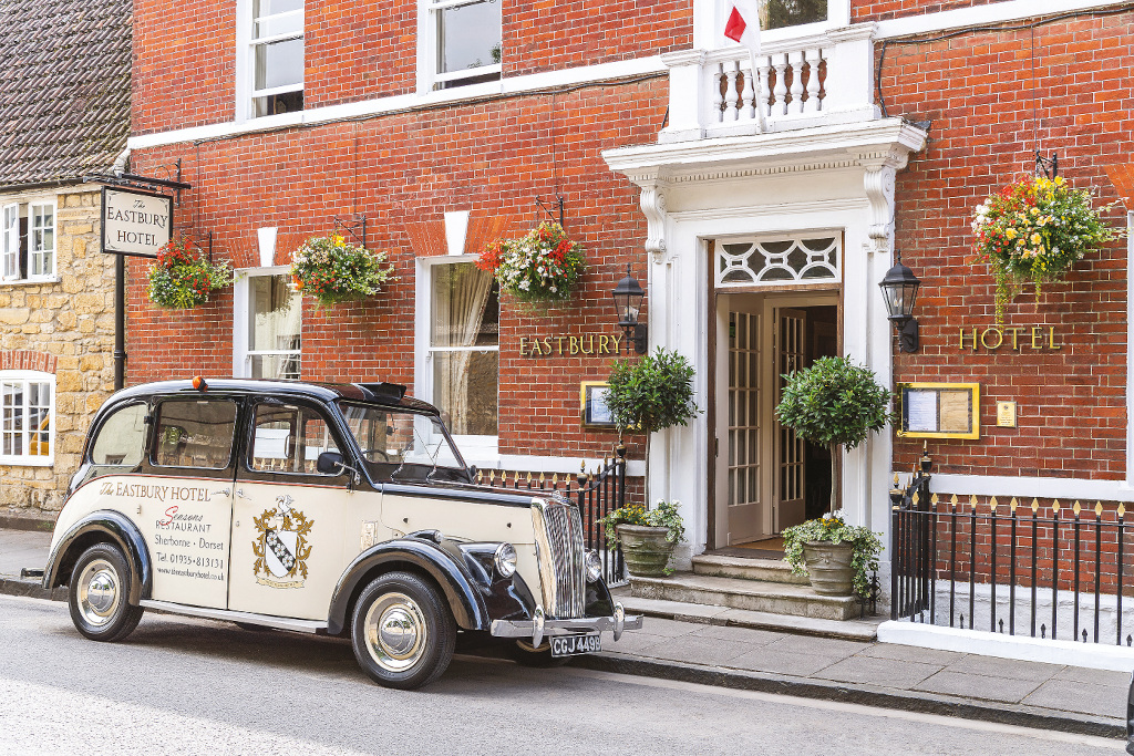 Cream taxi in front of The Eastbury